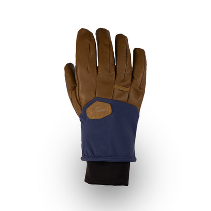 The Mainers Loaf Glove, ideal for ski enthusiasts, boasts a stylish brown and navy color scheme with a black cuff, providing both warmth and flair along the back of the hand.