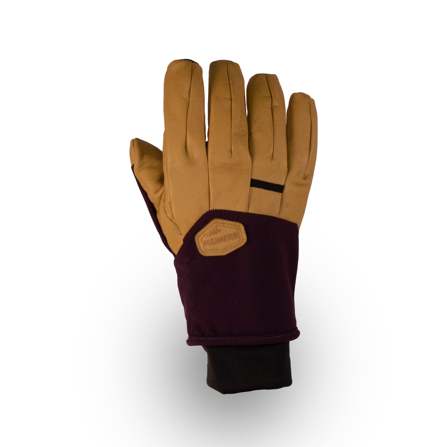 The Mainers Loaf Glove in tan and dark burgundy is equipped with a black cuff featuring a branding patch on the wrist. Crafted for cold-weather adventures, it includes leather palms and fingers for improved grip and durability.