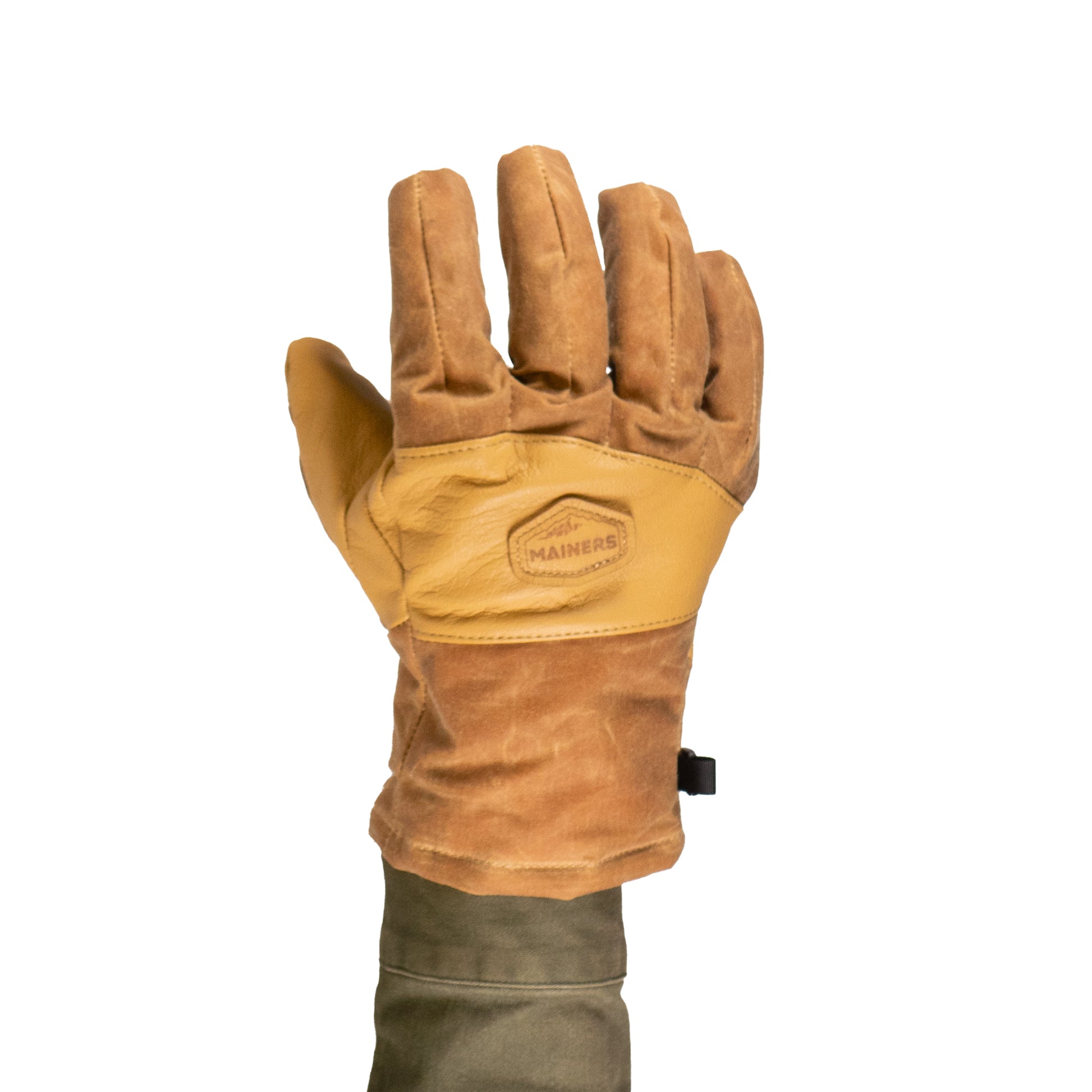 A person wearing a Mainers MT Battie Glove, showcasing its durable leather palm, raises their hand against a white background.