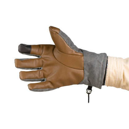 A Mainers Ragged MT Glove, in brown and gray with a black fingertip, is worn on a person's left hand with fingers spread apart, ideal for versatile winter adventures.